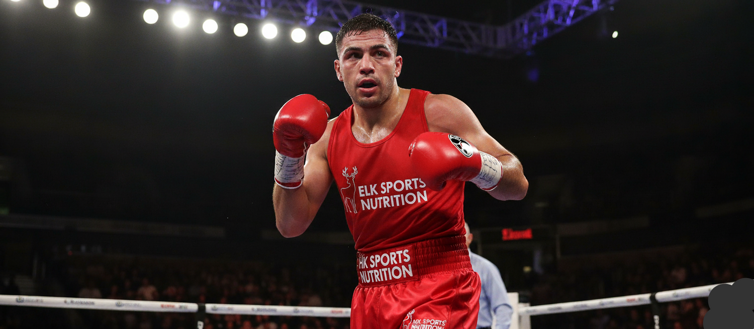 Boxer in red boxing gear with 'Elk Sports Nutrition' branding in a boxing ring.